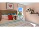 Bedroom with wood headboard, colorful bedding, and floating shelves at 110 Ethel Ln, Angier, NC 27501