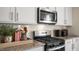 Stainless steel appliances and granite countertops highlight this kitchen at 110 Ethel Ln, Angier, NC 27501