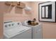Convenient laundry room with washer, dryer, and shelving at 110 Ethel Ln, Angier, NC 27501