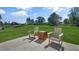 Relaxing patio with two chairs and a wooden side table at 110 Ethel Ln, Angier, NC 27501