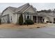 Side view of a charming two-story house with stone accents and landscaping at 13 E Milan Ct, Clayton, NC 27527