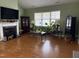 Spacious living room with fireplace and hardwood floors at 13 E Milan Ct, Clayton, NC 27527