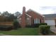 Brick home with deck and landscaped yard at 2004 Clyde Bank Ct, Cary, NC 27511