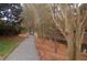 Gravel pathway alongside a pond and trees at 2004 Clyde Bank Ct, Cary, NC 27511