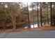 Serene pond view with autumnal trees at 2004 Clyde Bank Ct, Cary, NC 27511