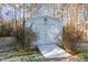 White shed with double doors and wooden ramp at 244 Shawnee Dr, Louisburg, NC 27549