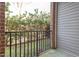 A peaceful balcony offers a serene view of the surrounding green landscape at 2621 Oldgate Dr # 105, Raleigh, NC 27604
