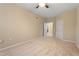A neutral bedroom leads to the kitchen through a connecting doorway at 2621 Oldgate Dr # 105, Raleigh, NC 27604