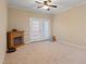 A neutral bedroom featuring an electric fireplace and a pair of French doors at 2621 Oldgate Dr # 105, Raleigh, NC 27604