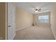 Carpeted bedroom featuring a ceiling fan and a window at 2621 Oldgate Dr # 105, Raleigh, NC 27604