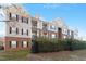 Attractive multi-story apartment building with brick and siding exterior and manicured landscaping at 2621 Oldgate Dr # 105, Raleigh, NC 27604