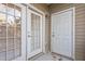 Exterior shot of two white painted doors on a patio at 2621 Oldgate Dr # 105, Raleigh, NC 27604