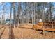 Spacious backyard with mature trees and wooden shed at 316 Trappers Run Dr, Cary, NC 27513