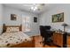 Bedroom with wooden bed frame, desk and chair at 316 Trappers Run Dr, Cary, NC 27513
