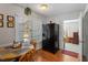 Bright dining area with wood table and chairs, adjacent to kitchen at 316 Trappers Run Dr, Cary, NC 27513