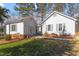 Gray house with a brick base and landscaped lawn at 316 Trappers Run Dr, Cary, NC 27513
