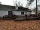 Rear view of house featuring a deck and ramp access at 316 Trappers Run Dr, Cary, NC 27513
