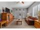 Comfortable living room with a leather couch and built in shelving at 316 Trappers Run Dr, Cary, NC 27513
