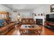 Spacious living room with a fireplace and hardwood floors at 316 Trappers Run Dr, Cary, NC 27513