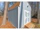 Gray shed with white trim and wooden ramp at 316 Trappers Run Dr, Cary, NC 27513