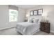 Charming bedroom with a full-size bed and window views at 38 Brazan Ct, Fuquay Varina, NC 27526
