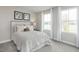 Cozy bedroom with a queen-size bed and large windows at 38 Brazan Ct, Fuquay Varina, NC 27526