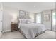 Spacious bedroom with large windows and neutral decor at 38 Brazan Ct, Fuquay Varina, NC 27526