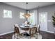 Modern dining area with round table and six chairs at 432 Providence Springs Ln, Fuquay Varina, NC 27526