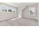 Bright bedroom featuring three large windows and plush carpeting, perfect for relaxation at 57 Nottoway Ln, Wendell, NC 27591