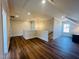 Spacious bonus room featuring hardwood floors, recessed lighting, and a staircase at 57 Nottoway Ln, Wendell, NC 27591