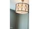 Close up on a modern, stylish chandelier with metal accents and soft lighting at 57 Nottoway Ln, Wendell, NC 27591