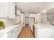 Contemporary kitchen with white cabinetry, quartz countertops, stainless steel appliances and a kitchen island at 57 Nottoway Ln, Wendell, NC 27591