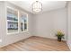 Inviting living room with wood floors, modern trim and large windows overlooking the neighborhood at 57 Nottoway Ln, Wendell, NC 27591