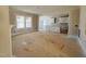 Open concept living room and kitchen with hardwood floors at 57 Nottoway Ln, Wendell, NC 27591