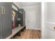 Mudroom with built in storage bench and cabinets with gold hardware at 57 Nottoway Ln, Wendell, NC 27591