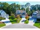 Aerial view of charming house with two-car garage and landscaping at 5904 Bellona Ln, Raleigh, NC 27612