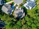 An aerial view showcasing a home's backyard and surrounding neighborhood at 5904 Bellona Ln, Raleigh, NC 27612