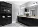 Double vanity bathroom with granite countertop and dark cabinets at 5904 Bellona Ln, Raleigh, NC 27612