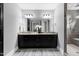 Double vanity bathroom with granite countertop and dark cabinets at 5904 Bellona Ln, Raleigh, NC 27612