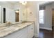 Double vanity bathroom with granite countertop at 5904 Bellona Ln, Raleigh, NC 27612