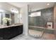Bathroom with double vanity, large shower, and bench at 5904 Bellona Ln, Raleigh, NC 27612