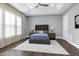 Secondary bedroom with hardwood floors and plenty of natural light at 5904 Bellona Ln, Raleigh, NC 27612