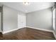 Well-lit bedroom with double doors and hardwood floors at 5904 Bellona Ln, Raleigh, NC 27612