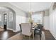 Formal dining room with wainscoting, chandelier and hardwood floors at 5904 Bellona Ln, Raleigh, NC 27612