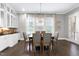 Dining room featuring a wooden table and access to backyard at 5904 Bellona Ln, Raleigh, NC 27612