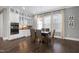 Bright dining room with a wooden table and six chairs at 5904 Bellona Ln, Raleigh, NC 27612