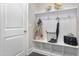 Neat entryway with bench, hooks, and storage at 5904 Bellona Ln, Raleigh, NC 27612