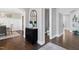 Bright foyer with hardwood floors, powder room and staircase at 5904 Bellona Ln, Raleigh, NC 27612