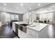 Modern kitchen features a large island with a farmhouse sink at 5904 Bellona Ln, Raleigh, NC 27612