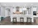 Open concept kitchen with large island and stainless steel appliances at 5904 Bellona Ln, Raleigh, NC 27612